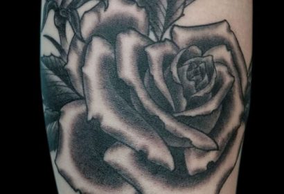 traditional black and grey rose tattoo