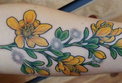 yellow flowers creosote tattoo featured image
