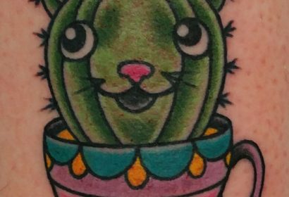 traditional style cactus cat tattoo