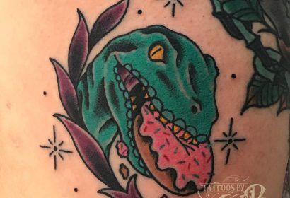 Traditional style dino donut tattoo by Jake B