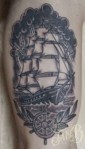 black and grey traditional style clipper ship tattoo
