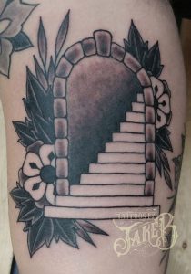 black and grey traditional style staircase tattoo