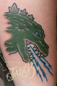 Traditional style godzilla tattoo by Jake B