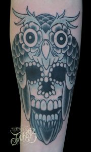 black and grey owl skull tattoo