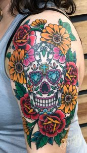 sugar skull and flowers tattoo