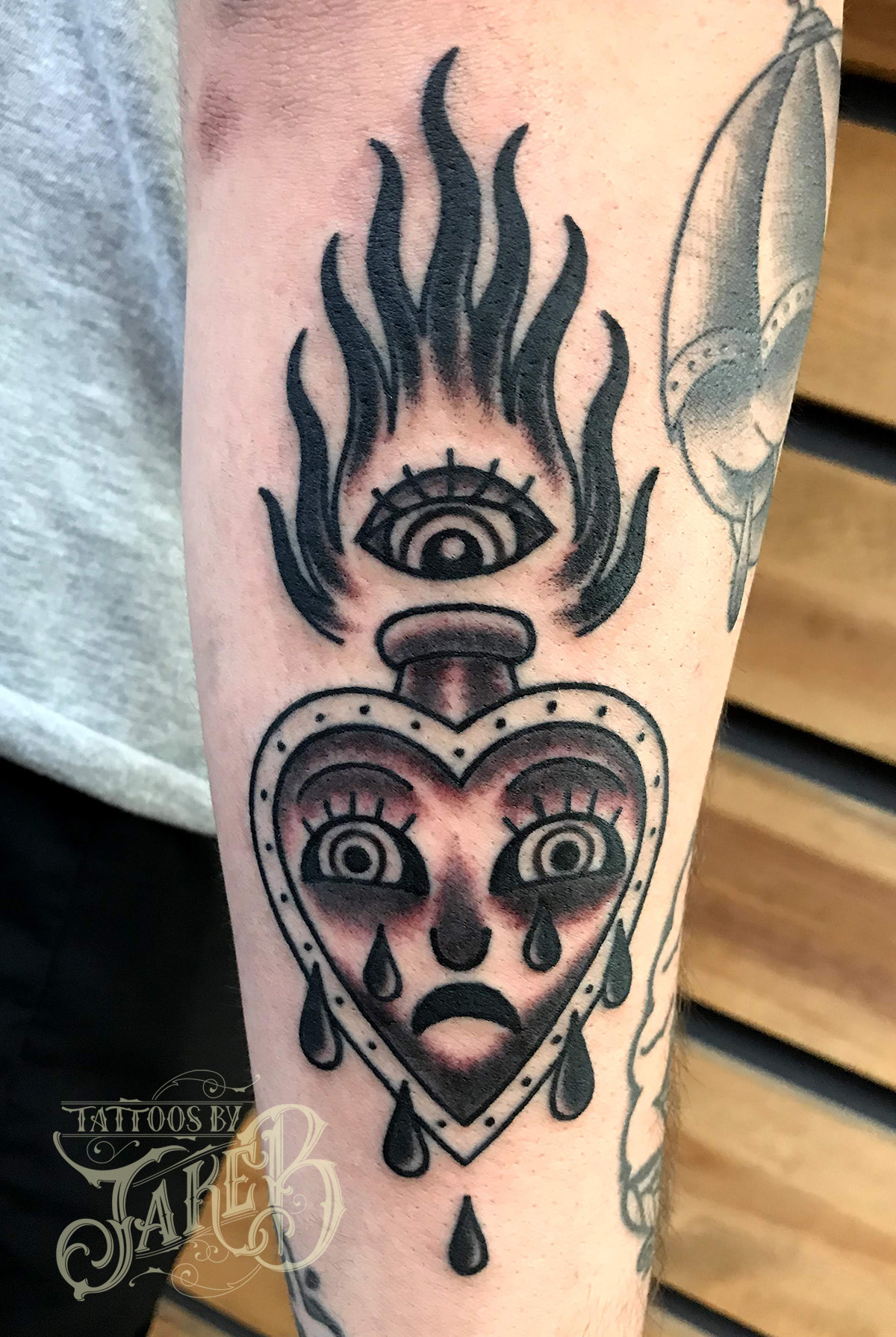 black & grey crying heart tattoo by Jake B