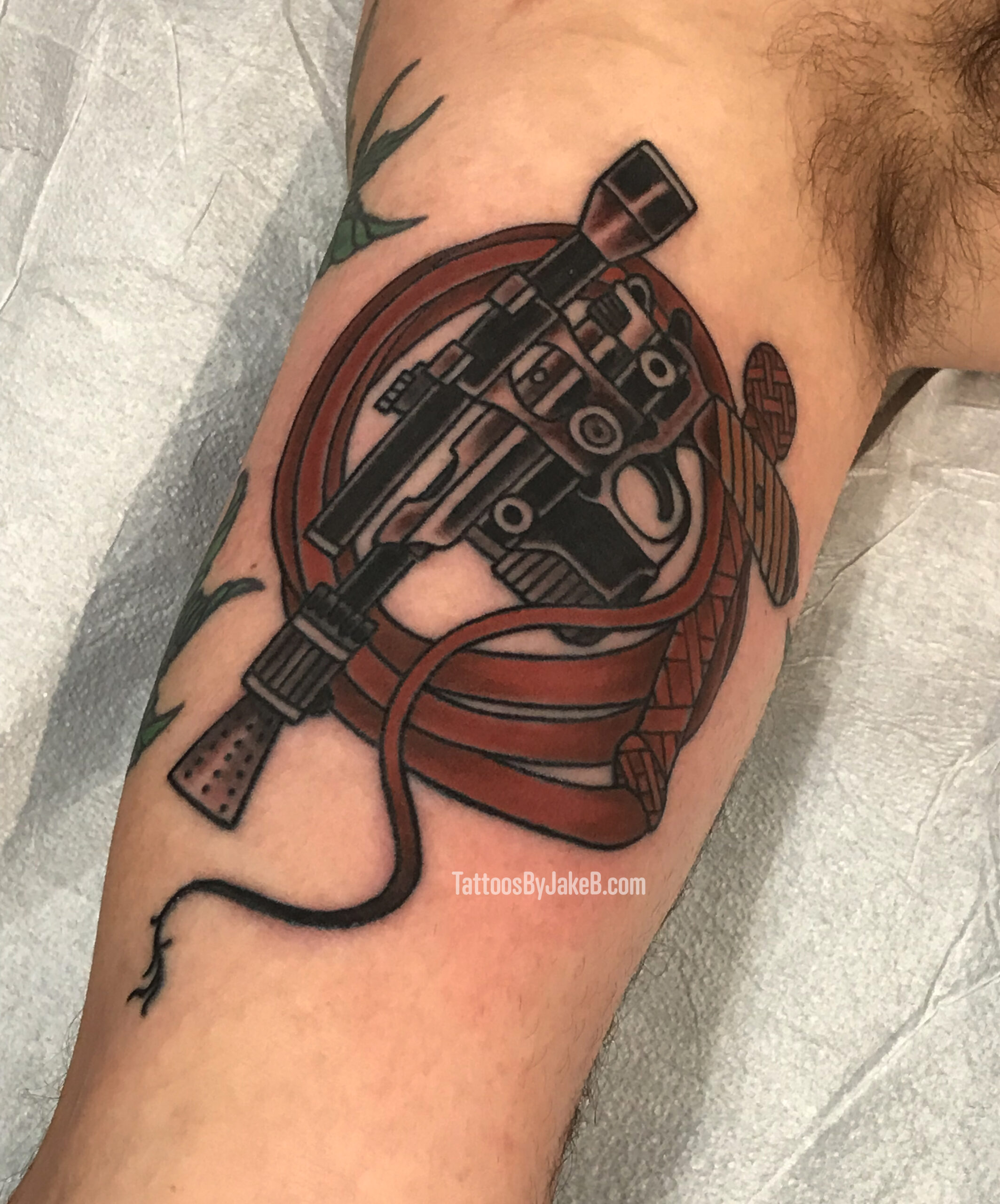 Han Blaster and Indy Whip tattoo by Jake B